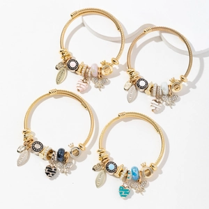 Adjustable golden stainless steel open bangle with butterfly and enamel heart charms