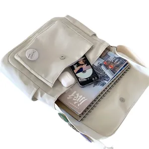 Off-white canvas messenger bag with large capacity multi-pocket structure and magnetic closure