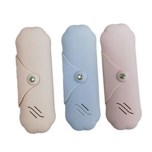 Portable silicone makeup brush holder set in beige, light blue, and pink with wave vents