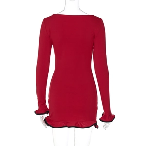 Rear view detail of a slim-fit red knit dress featuring black ruffled hem and cuffs