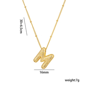 Detail shot of 18K gold plated letter M pendant with clear pave zircon and size specs