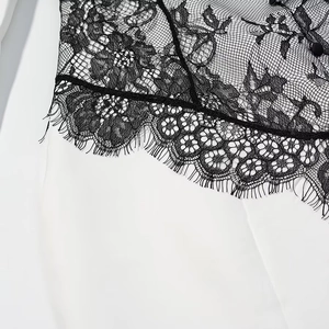Fashionable dress with black floral eyelash lace splicing and white fabric details