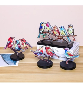 Artistic stained glass style birds on a branch with a sleek black desktop stand