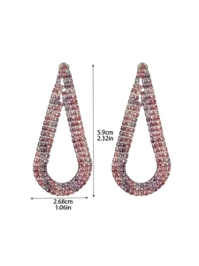 Detail showing the 5.9cm long pink gradient teardrop tassel earrings with rhinestones