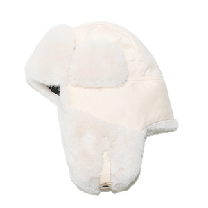 Detail of cream faux suede trapper hat featuring plush faux fur lining and ear flaps