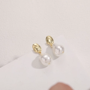 Baroque style teardrop pearl earrings with 14K gold plated minimalist geometric design