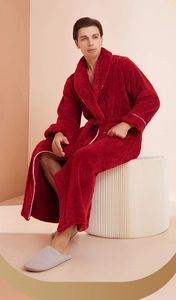 Close-up of deep red thickened flannel robe showing soft plush texture and shawl collar