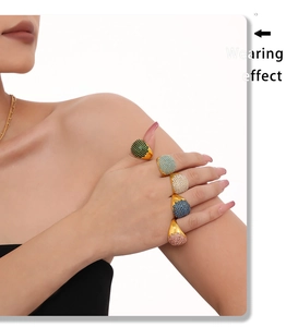 Wearing effect of multiple 18K gold plated rings with colorful pavé set cubic zirconia