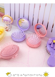 Brosse à cheveux pliante avec miroir et noeud papillon mignon pour voyage et usage quotidien.