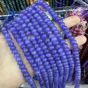 Macro detail of 5x8mm purple abacus-shaped natural stone beads for DIY jewelry making