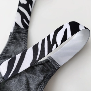 Women's cotton thong featuring wide zebra print elastic straps and grey ribbed fabric