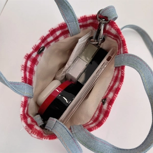 Top view of plaid wool tote bag interior with magnetic snap and daily essentials