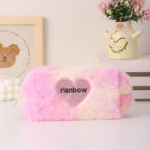 Close-up of gradient plush bag with glitter rainbow heart patch and soft fur texture