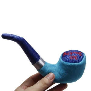 Detail of blue pipe-shaped plush dog toy with No Smoking embroidery and woven fabric