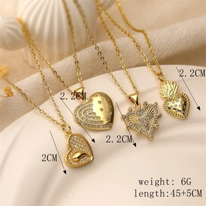 Detail of four gold plated heart necklaces in a white dish with size and weight info