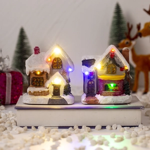 Lighted Christmas village house ornament with LED lights and snow scene decor