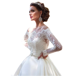 Elegant off-shoulder bridal gown with long lace sleeves and a sparkling crystal belt