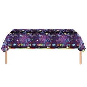 Neon video game controller party tablecloth with Game On text for birthday decor