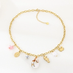 Detail showing stainless steel starfish, seashell, and seahorse charms on a gold necklace