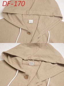 Detail of linen blend hoodie featuring wooden buttons and material label with size info