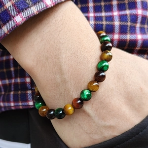 Handcrafted tiger eye beaded bracelet featuring green brown and yellow gradient stone beads