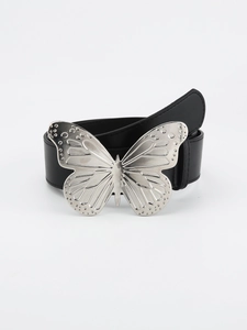 Detail shot of black leather belt featuring a large silver metal butterfly buckle