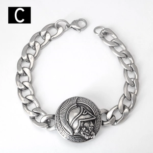 Detail view of vintage stainless steel Cuban link bracelet with Spartan helmet emblem