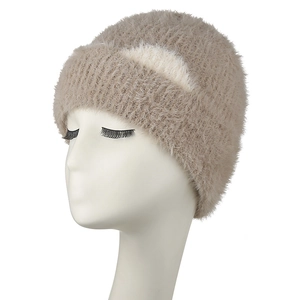 Detailed texture of khaki furry knit beanie with white cat ear pattern on mannequin