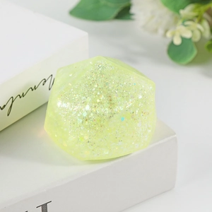 Sparkly light green polyhedron stress relief toy with glitter and slow rebound effect