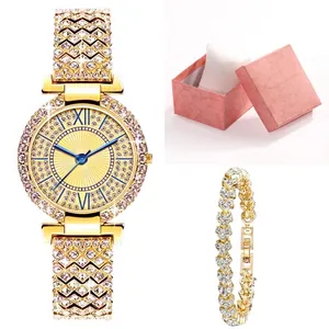 Detailed view of luxury gold quartz watch set with rhinestones and heart bracelet in box