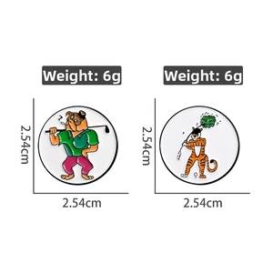 Detail showing golf themed enamel pins featuring bulldog and tiger designs with weights