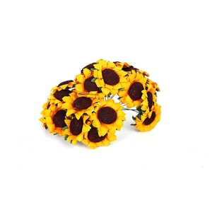 Bulk artificial yellow sunflowers with brown centers and green leaves on white background