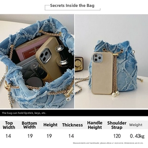 Detailed size specifications for the denim crossbody bag showing dimensions and strap length