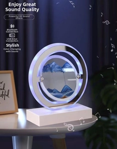 Macro detail of round quicksand art lamp with blue sand movement and Bluetooth speaker