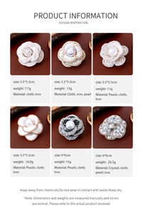 Detailed view of handmade fabric camellia brooches with pearls and crystals set of six