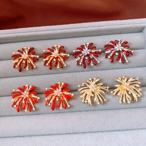 Macro detail of vintage firework earrings with zircon inlay in various color patterns