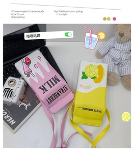 Macro view of strawberry milk and lemonade carton shaped crossbody bags in PU leather