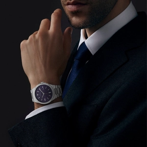 Men's business watch with purple textured dial and silver stainless steel strap on wrist