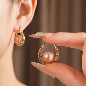 French vintage champagne gold U-shaped pearl earrings with sparkling diamond pavé