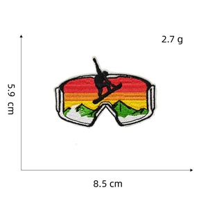Detail of ski goggles embroidery patch with mountain sunset scene and size dimensions