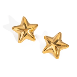 Close-up of golden star stud earrings in polished titanium steel with metallic shine