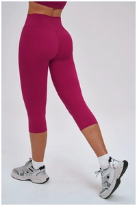 Rear view of high-waisted yoga shorts in rose red with V-shaped peach hip lifting line