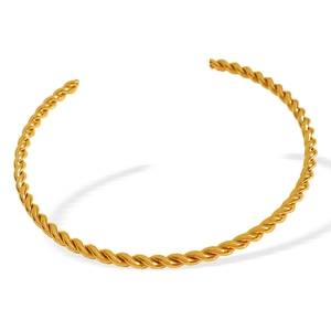 Chic twisted rope open bangle in gold-plated stainless steel on white background