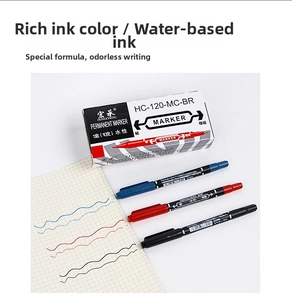 Dual-tip markers in black red and blue showing fine tip details and ink strokes on paper