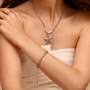 Silver tone jewelry set featuring starfish pendant necklace, pearl bracelet and flower ring