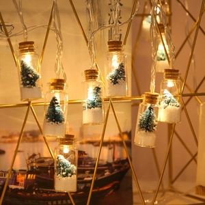 LED wishing bottle fairy lights with mini Christmas trees and warm yellow glow inside