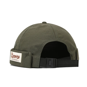 Olive green ripstop docker cap with adjustable strap and camping patch detail