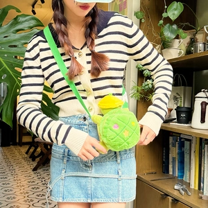 Cute green plush turtle crossbody bag with colorful shell patterns and yellow hat