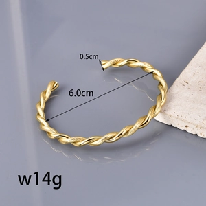 Minimalist twisted gold cuff bracelet in polished stainless steel for a vintage look