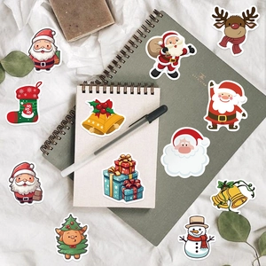 Detailed view of assorted Christmas stickers featuring Santa, reindeer, and festive motifs